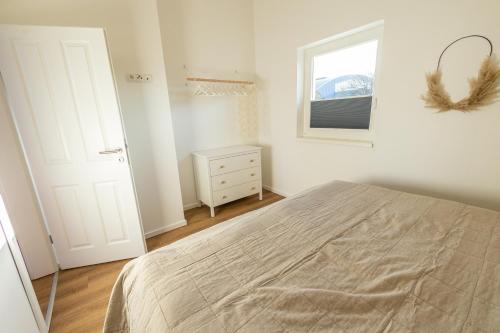 Ein Bett oder Betten in einem Zimmer der Unterkunft Das Seehaus