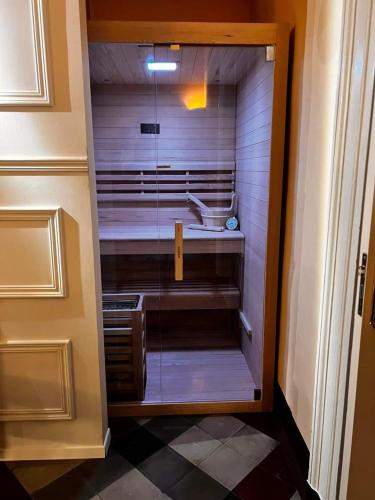 a walk in closet with a sink in a bathroom at Toscano Palace Luxury Rooms Catania in Catania
