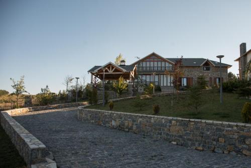 a stone path in front of a house at Luxury Villa Saint Nikolas in Voskopojë