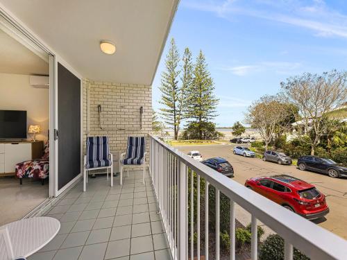 a balcony with a view of a parking lot at Nelson Point Unit 2 Golden Beach QLD in Golden Beach