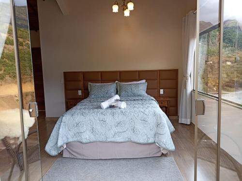 a bedroom with a bed with a teddy bear on it at Valle Piemonte in Divisa