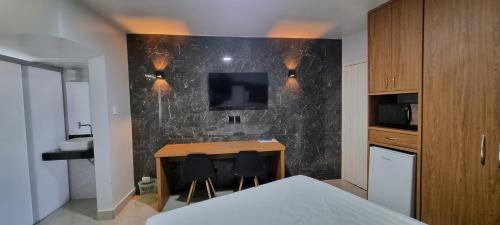 Televisyen dan/atau pusat hiburan di ARARAS Apart Hotel - CTC
