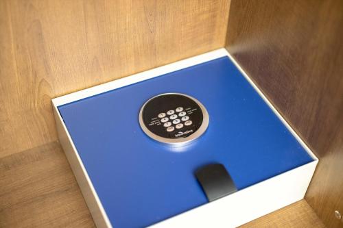 a remote control sitting inside of a box at Holiday Inn Express & Suites - San Jose Silicon Valley by IHG in San Jose