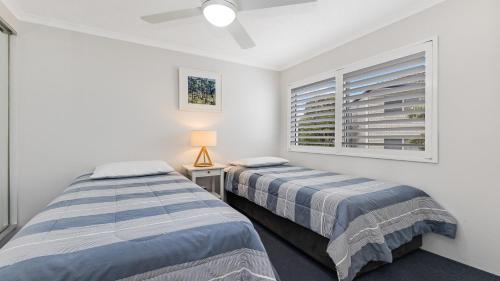 Postel nebo postele na pokoji v ubytování Tranquil Shores Unit 16 Caloundra QLD