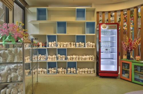 a store filled with lots of stuffed animals on shelves at Vinpearl Resort & Golf Nam Hoi An in Hoi An