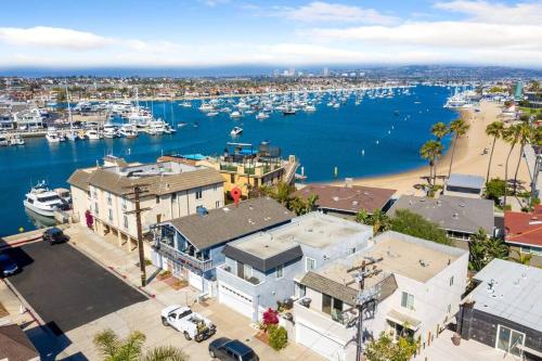 an aerial view of a harbor with boats in the water at Walk on the Ocean! Wake up to Beautiful Bay Views in Newport Beach