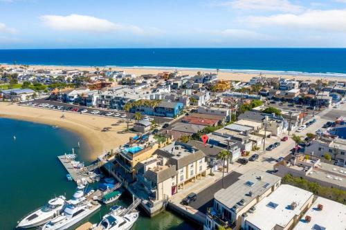 an aerial view of a harbor with boats in the water at Walk on the Ocean! Wake up to Beautiful Bay Views in Newport Beach