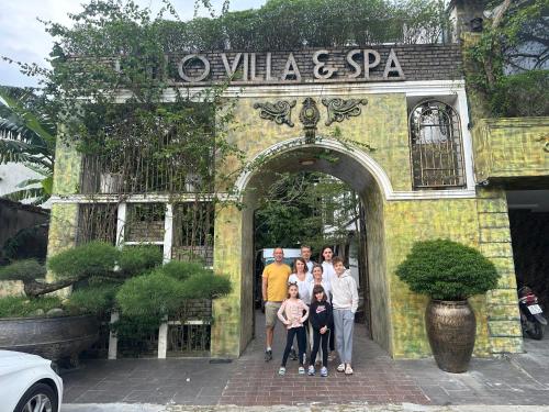 a group of people standing in the doorway of a building at HELLO VILLA & SPA in Hue
