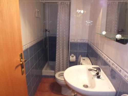 a bathroom with a sink and a toilet and a shower at Apartamento Roses, 2 dormitorios, 6 personas - ES-204-49 in Roses