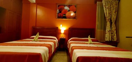 Кровать или кровати в номере Hotel Florida Oaxaca
