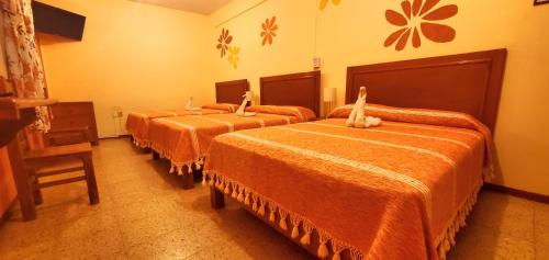 Кровать или кровати в номере Hotel Florida Oaxaca