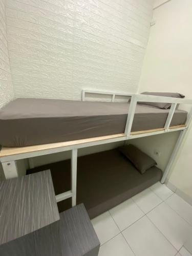 a small room with a bunk bed in it at Stay Hub in Timuran