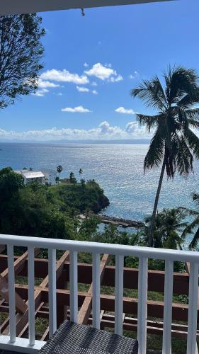 a view of the ocean from a balcony at Vista Mare Samana Amazing Views!! in Santa Bárbara de Samaná