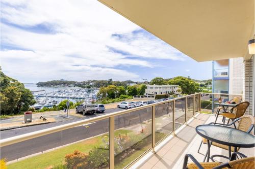 a balcony with a view of a harbor at Laman Lodge, 1,15 Laman Street - Stunning Views, air conditioned unit with water views and Wifi in Nelson Bay