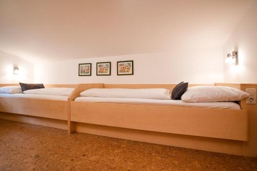 two beds in a room with two at Ferienparadies Taxen in Sankt Veit im Pongau