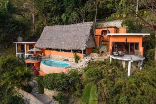 an aerial view of a house with a swimming pool at Casa Flourish, Yelapa in Yelapa