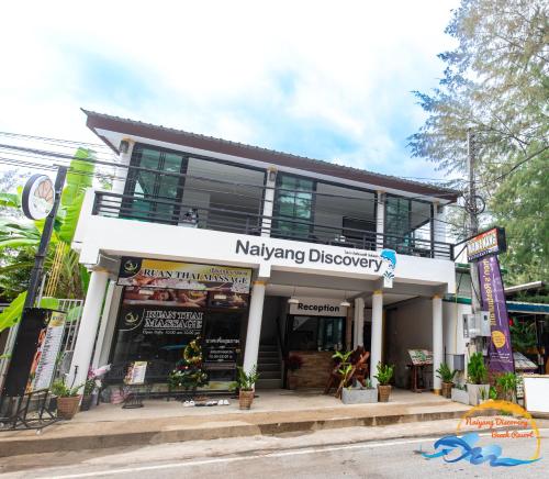 a building with a sign that reads navying discovery at Naiyang Discovery Beach Resort in Nai Yang Beach