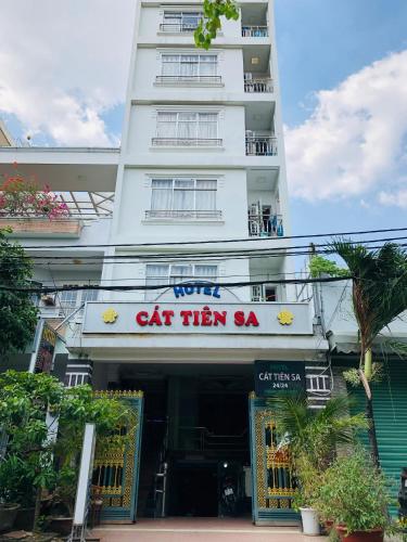 a white building with a sign that reads cat them sa at Hotel Cát Tiên Sa in Ho Chi Minh City