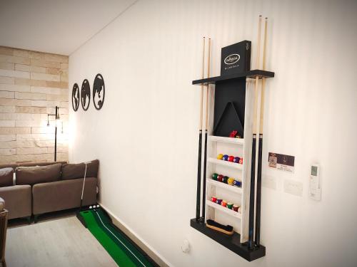 a living room with a game system on the wall at 1st Luxury Warehouse in Cancún