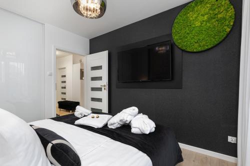 Ένα ή περισσότερα κρεβάτια σε δωμάτιο στο Apartament Baltini Premium Polanki Park