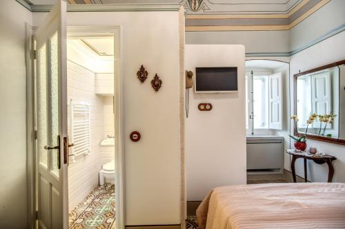 Cama o camas de una habitación en Palazzo Stunis - Dimora di Charme
