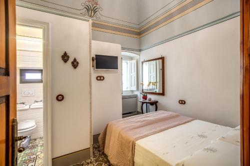 Cama o camas de una habitación en Palazzo Stunis - Dimora di Charme