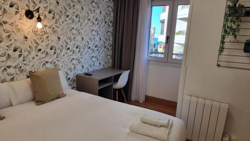 Ένα ή περισσότερα κρεβάτια σε δωμάτιο στο Hotel Norte