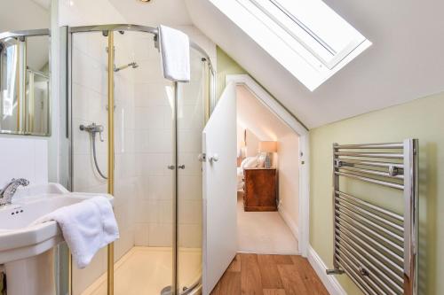 a bathroom with a shower and a sink at Sea Way in Middleton-on-Sea