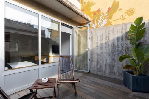 a balcony with a chair and a window at Onix Liceo in Barcelona