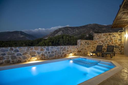 a swimming pool with a view of mountains at Sia Elafonisi Pool House in Elafonisi