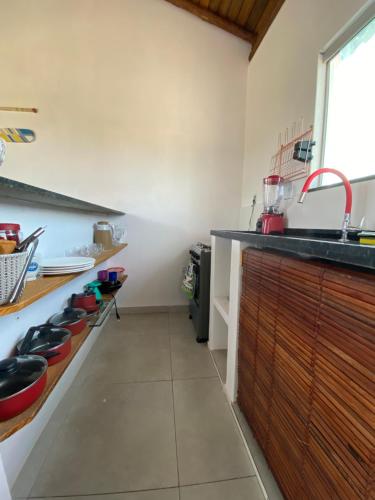 a kitchen with a sink and a counter top at Villa Ohana - Taipu de Fora in Taipu