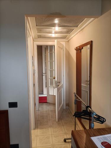 a hallway with a hallway leading to a room at Hotel Riva Etrusca in Marina di Bibbona
