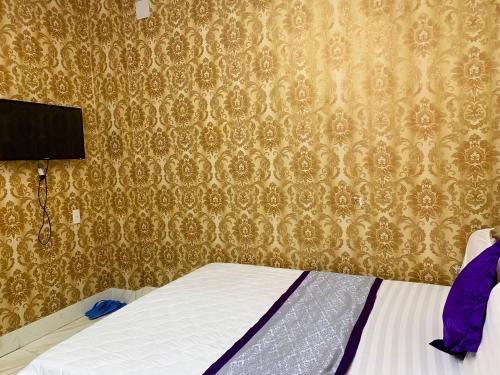 Postel nebo postele na pokoji v ubytování NGỌC MẤY - ĐẠI LỢI HOTEL