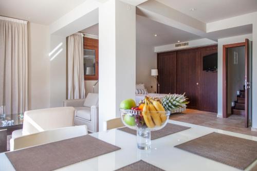 a bowl of fruit on a table in a living room at SAZ VILLAS in Syvota