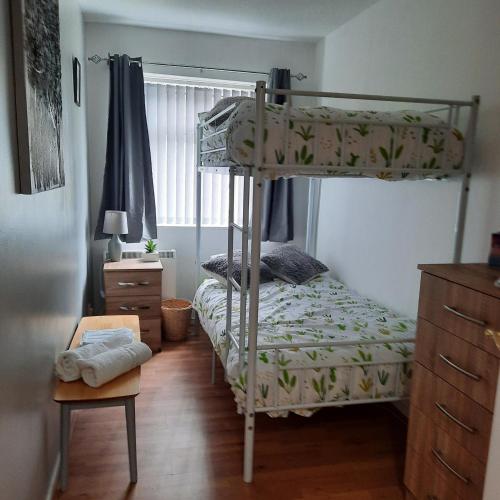 a bedroom with a bunk bed and a desk at Blenheim Way is a beautiful apartment in a quiet location yet minutes from major attractions and City centre Great for families Sleeps 6 in Birmingham