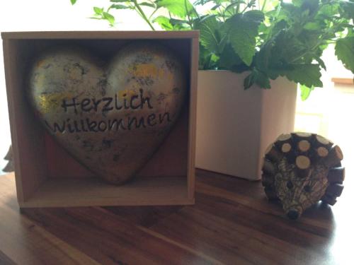a picture of a heart in a wooden box at Landhaus Rossberg in Tannheim