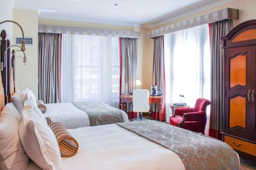 Postel nebo postele na pokoji v ubytování Hotel Providence