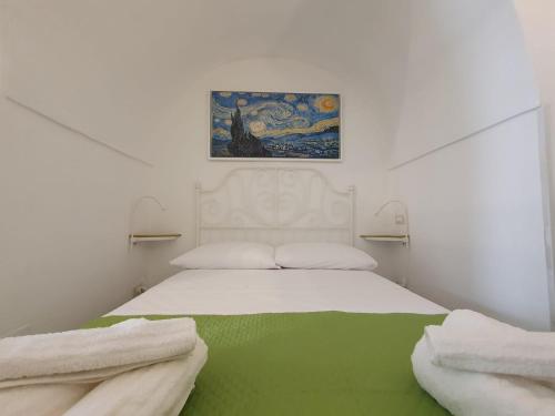 A bed or beds in a room at Il sottano alla strada Polignano a mare