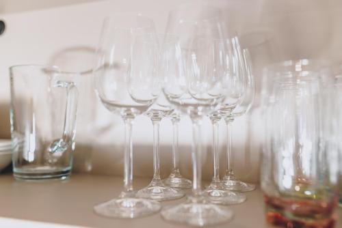 a group of wine glasses sitting on a table at Appartements Sulzer by we rent, SUMMERCARD INCLUDED in Zell am See