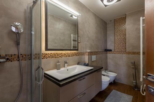 a bathroom with a sink and a shower and a toilet at Luxury Residence with a Beautiful view for the Danube River in Budapest