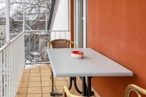 a table with a bowl on top of it on a balcony at Radolfzell Bodensee in Radolfzell am Bodensee