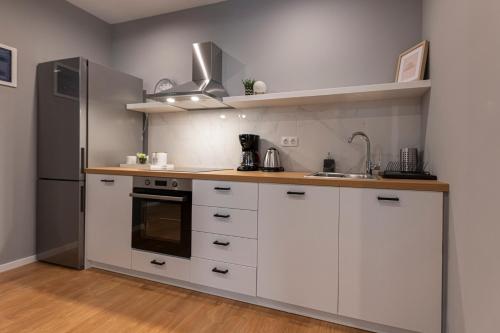 A kitchen or kitchenette at Athenian center apartments