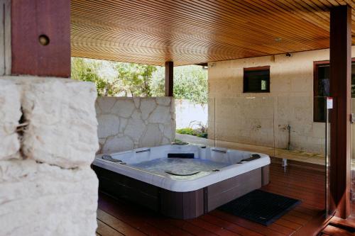 a large bath tub sitting in a room with at Losari Retreat in Margaret River Town