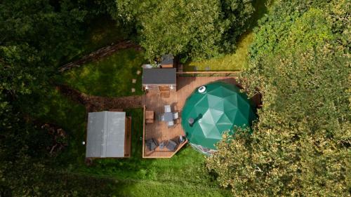 an overhead view of a house with a green roof at Luna Domes in Chiddingstone