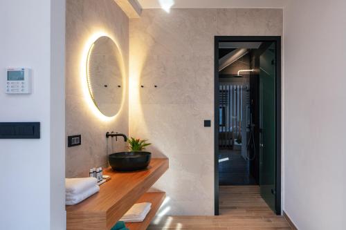 a bathroom with a sink and a mirror at Villa Anasa in Palaiochóra