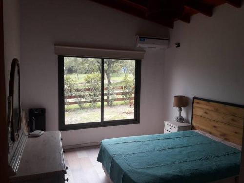 Ένα ή περισσότερα κρεβάτια σε δωμάτιο στο Casa Villa General Belgrano