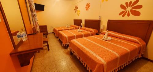 Кровать или кровати в номере Hotel Florida Oaxaca