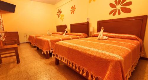 Кровать или кровати в номере Hotel Florida Oaxaca