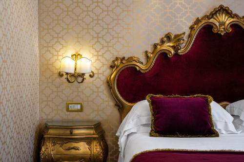 Un ou plusieurs lits dans un hébergement de l'établissement Hotel Concordia