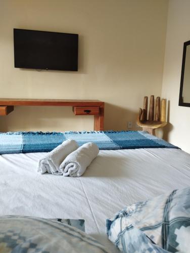 Postel nebo postele na pokoji v ubytování Andorinhas Suites